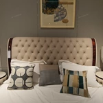 Diamond-Tufted Leather Bed with Curved High-Gloss Wood Side Borders